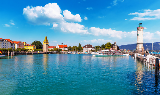 Scenic summer view of the Old Town pier architecture and ancient lighthouse tower in Lindau, Bodensee or Constance Lake, Germany