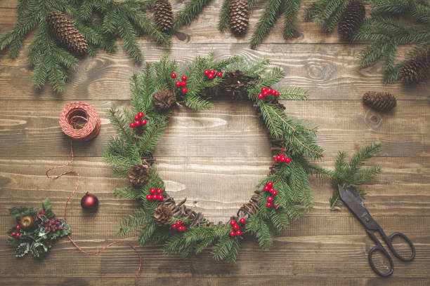 istock Making Christmas wreath using fresh and all natural materials. Flat lay. Top view. 1043720946