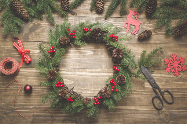 istock Making Christmas wreath using fresh and all natural materials. Flat lay. Top view. 1043720960