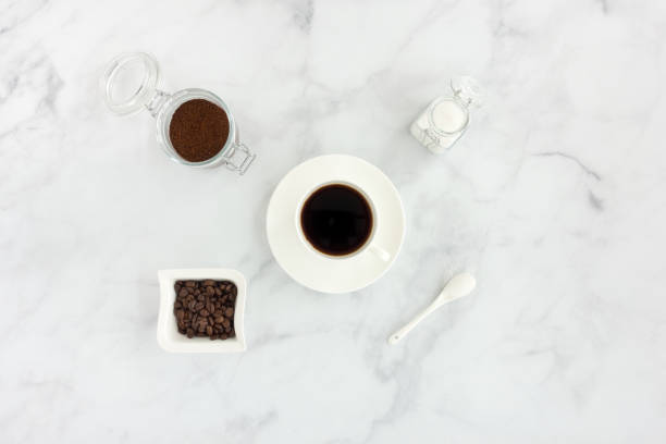 istock Black Coffee in Coffee Cup, Sugar, Ground Coffee and Beans 1043725788