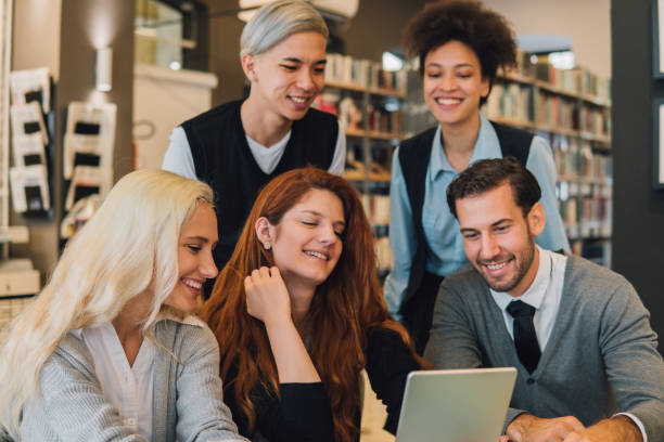 istock Group of students looking at digital tablet 1043727022