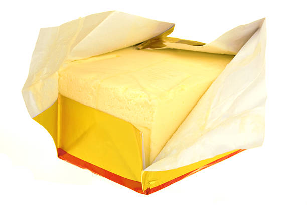 Butter in paper stock photo