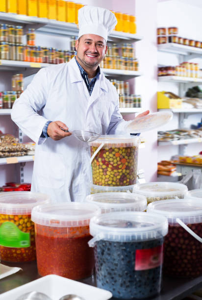 istock Salesman offering salted olives 1043730168