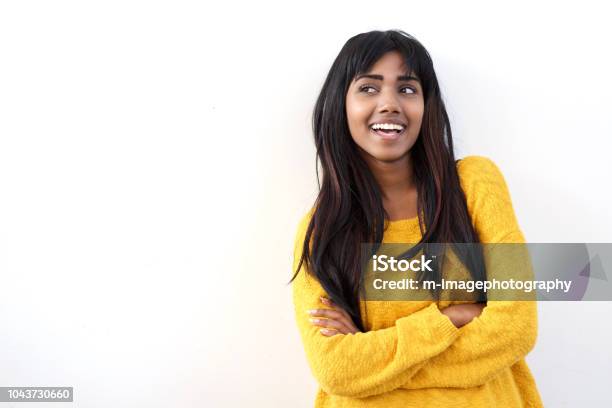 Attractive Young Indian Woman Smiling And Glancing At Copy Space Isolated White Background Stock Photo - Download Image Now