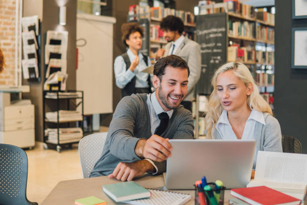 istock Couple reading from laptop 1043733830