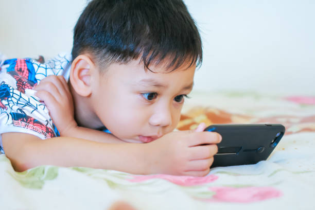 istock Children hands hold smartphone 1043734106