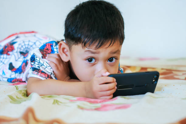 istock Children hands hold smartphone 1043734114