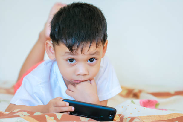 istock Children hands hold smartphone 1043734124