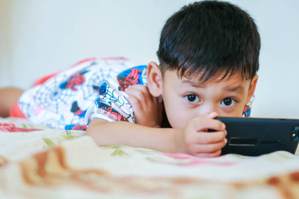 istock Children hands hold smartphone 1043734134