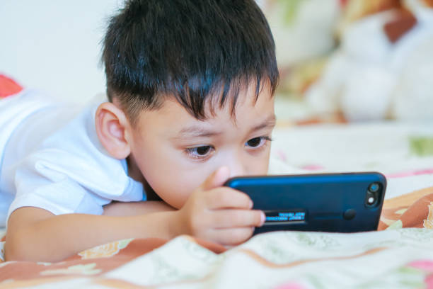 istock Children hands hold smartphone 1043734158