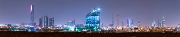 Outside distance skyline view on Riyadh Kingdom tower RIYADH, SAUDI ARABIA - OCTOBER 15, 2015: Outside distance skyline view on Riyadh Kingdom tower, Al Faisaliah and other business skyscrapers, full wide panorama riyadh photos stock pictures, royalty-free photos & images