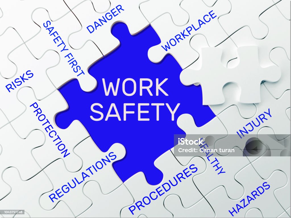 WORK SAFETY - PUZZLE CONCEPT Occupational Safety And Health Stock Photo