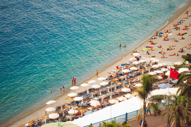 istock People sunbathing on a beach in Nice, France 1043751862