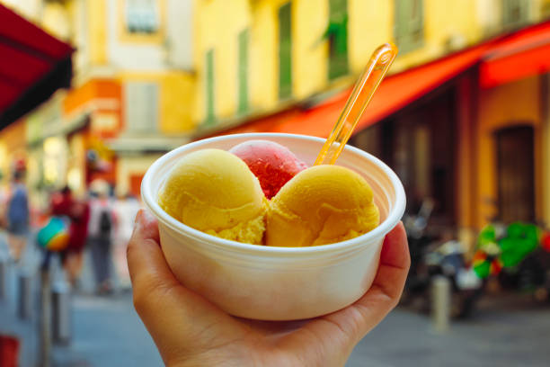 istock Young man holding an ice cream bowl 1043752104