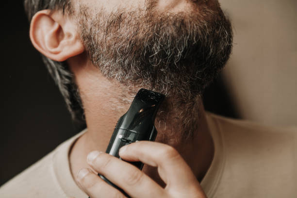 istock Haircut with gray hair trimmer 1043752366