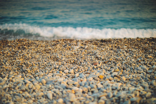 The Mediterranean sea and pebbles stones on a beach in Nice
