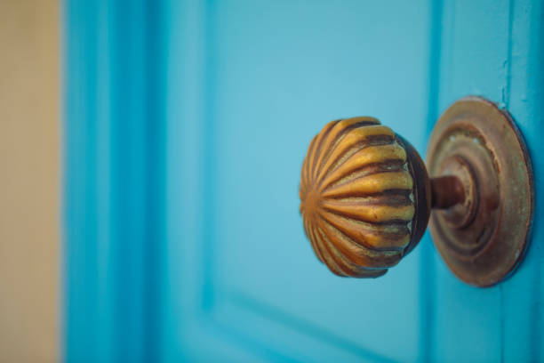 Door with brass knocker in the shape of a decor,  beautiful entrance to the house, vintage decoration