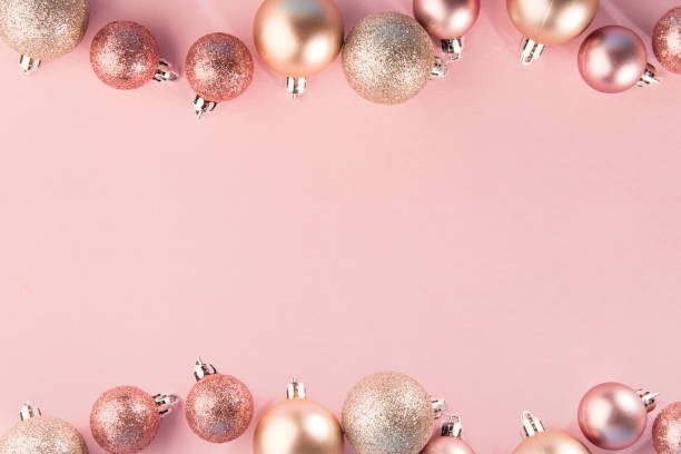 istock Pink baubles in row on pink 1043769714