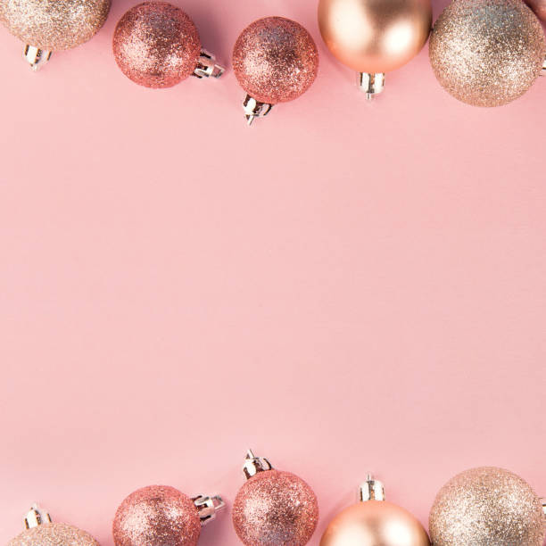 istock Pink baubles in row on pink 1043769738