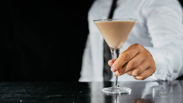istock Barman preparing white cocktail with ice 1043778894