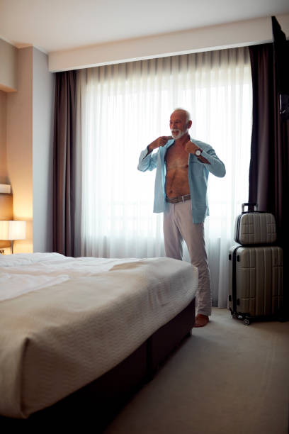 istock Senior Man Getting Ready For New Year Party 1043779028