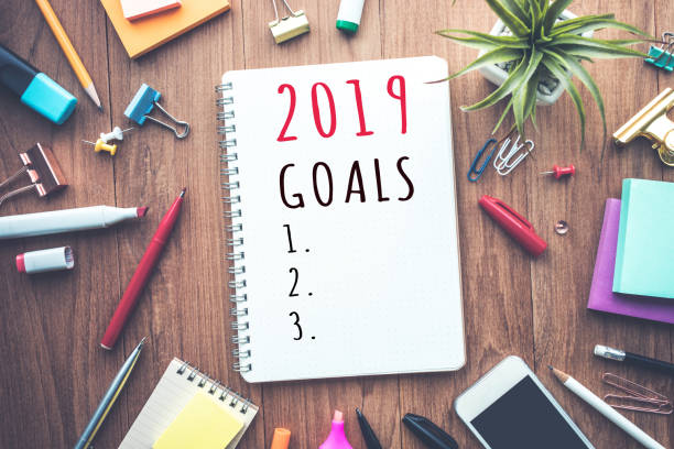 istock 2019 goals text on notepad with office accessories.Business plan,direction concepts 1043782694