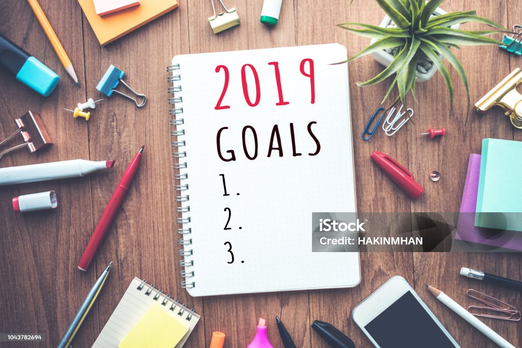 2019 goals text on notepad with office accessories.Business plan,direction concepts 2019 goals text on notepad with office accessories.Business plan,direction concepts ideas 2019 Stock Photo