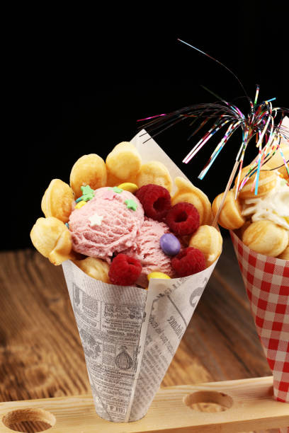 istock Hong Kong style egg waffle on wooden board. bubble waffle 1043783076