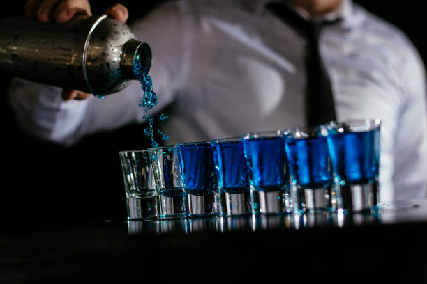istock Pouring blue cocktail shots 1043783416
