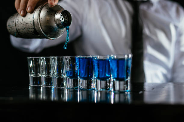 istock Pouring blue cocktail shots 1043785912
