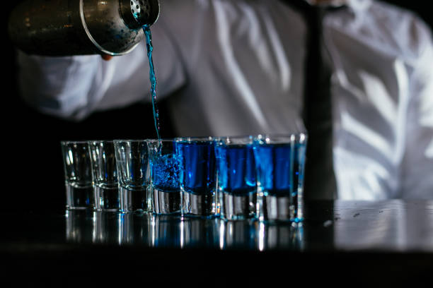 istock Pouring blue cocktail shots 1043785980
