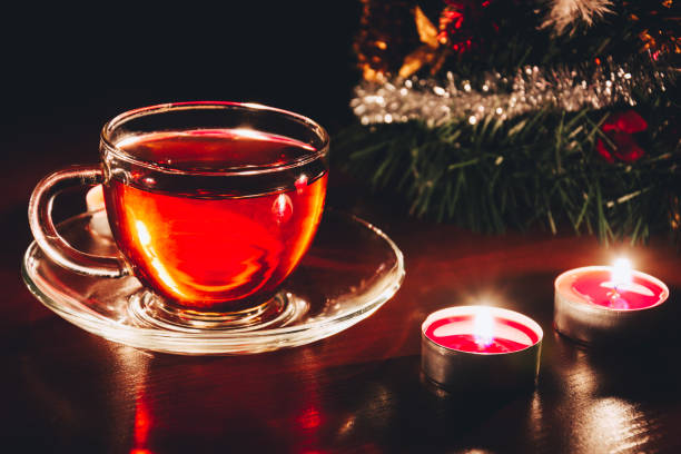 istock Cup of black tea and small candles 1043786008