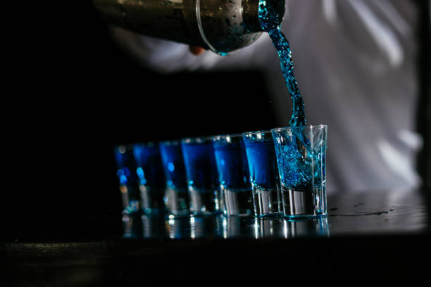 istock Pouring blue cocktail shots 1043787014