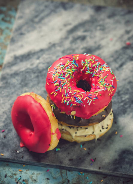 Fresh homemade glazed donuts with various toppings