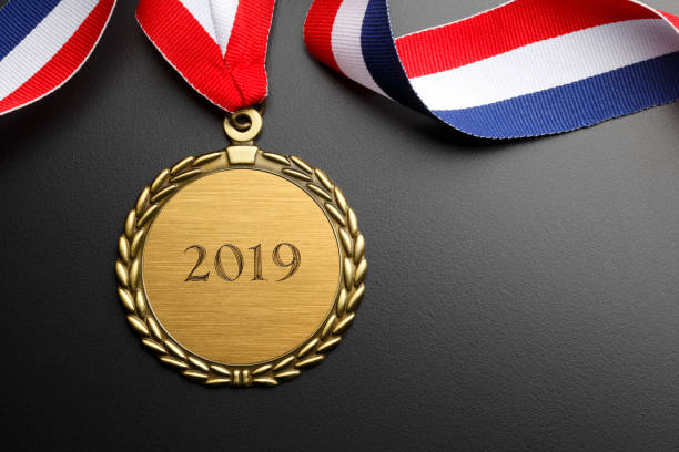 istock Gold Medal Engraved With 2019 On Black Background 1043792042
