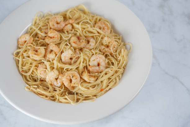 istock Shrimp Scampi on pasta 1043792436