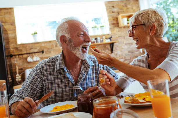 istock Senior couple having breakfast 1043792646