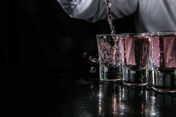 istock Barman pouring shots in cocktail bar 1043792680