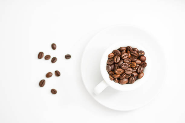 istock coffee cup full of roasted coffee beans 1043793332