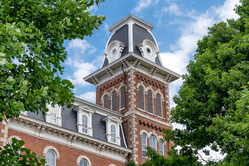 FAYETTEVILLE, AR/USA - JUNE 8, 2018: University Hall at Old Main on the campus of the University of Arkansas.