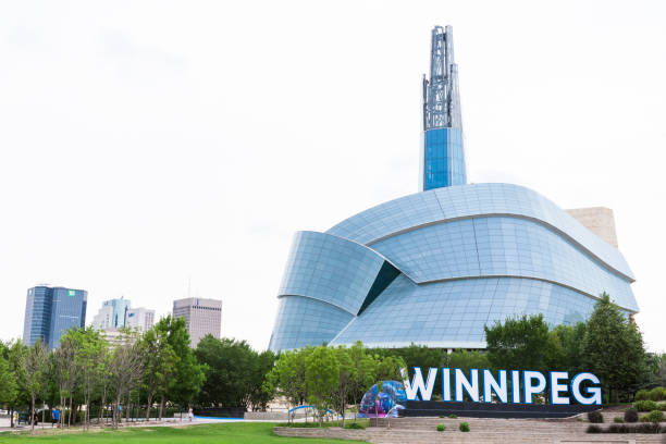 city sign and canadian museum of human rights in winnipeg, manitoba, canada - urban scene canada city winnipeg imagens e fotografias de stock