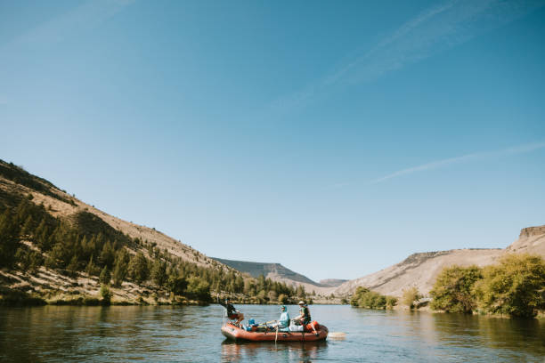 istock Group of Friends Raft Down Deschutes River in Eastern Oregon 1043818982