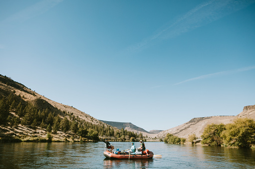 A fun end of summer vacation, a group of men take a casual rafting trip on the Deschutes River in Oregon state, enjoying white water rapids and fly fishing.  Three day trip, starting in Warm Springs and pulling out in Maupin.