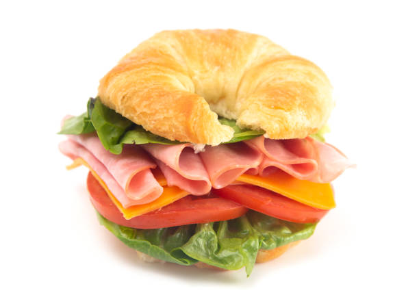 istock Ham and Cheese Sandwhich with Lettuce Cheese and Tomatoes on a Fresh Croissant 1043819028
