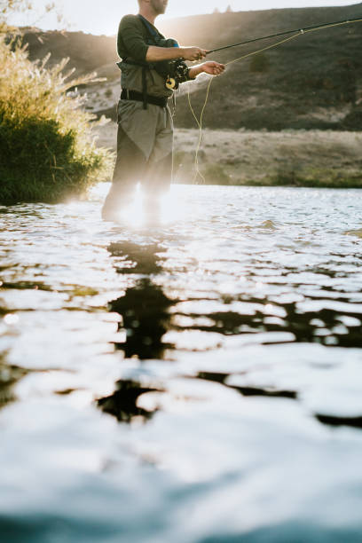 istock Man Fly Fishing On Deschutes River Rafting Trip 1043820706