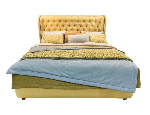 istock Luxury yellow modern bed furniture with patterned bed with leather upholstery capitone texture headboard and fabric bedclothes. Classic modern furniture on isolated background 1043821720