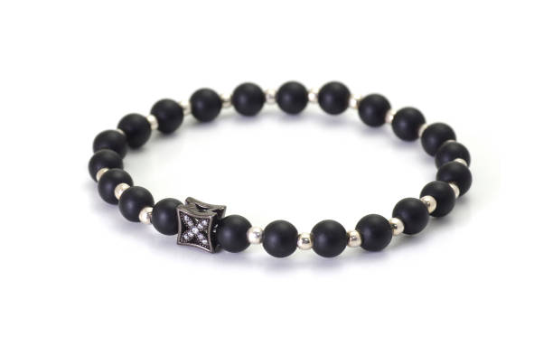 Elegant black onyx bracelet with silver balls isolated on white