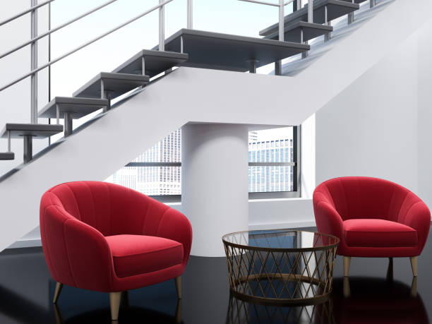 istock White loft office waiting area, red armchairs 1043824302
