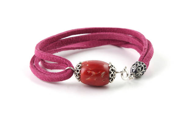 istock Red coral bead bracelet isolated on white 1043824978