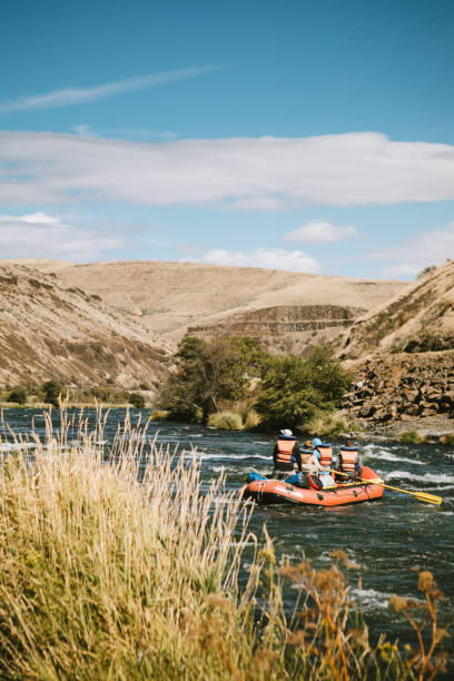 istock Group of Friends Raft Down Deschutes River in Eastern Oregon 1043825148